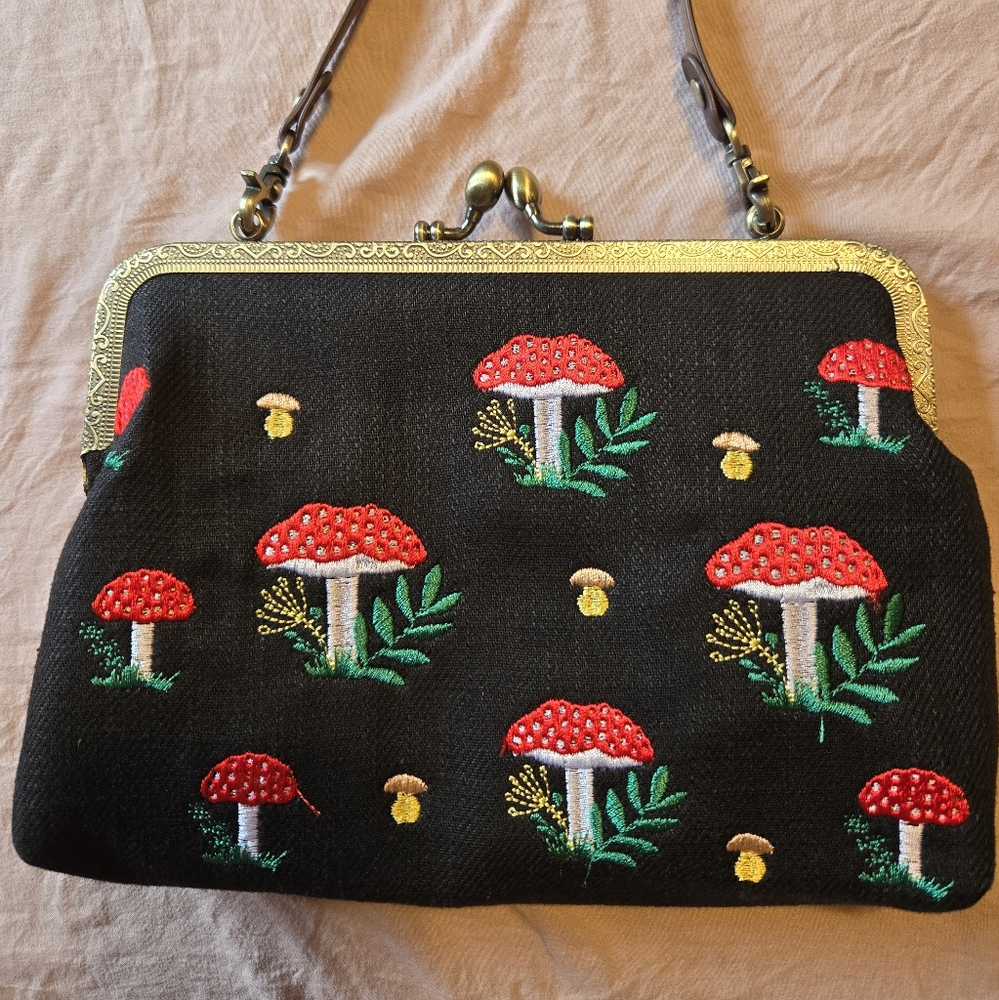 Embroidered Black Handbag with Red and Green Accents